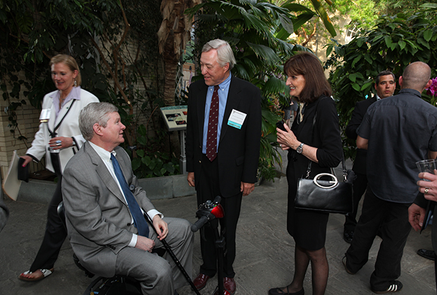 Dr. W. Carter Johnson and Janet Johnson greet U.S. Senator Tim Johnson